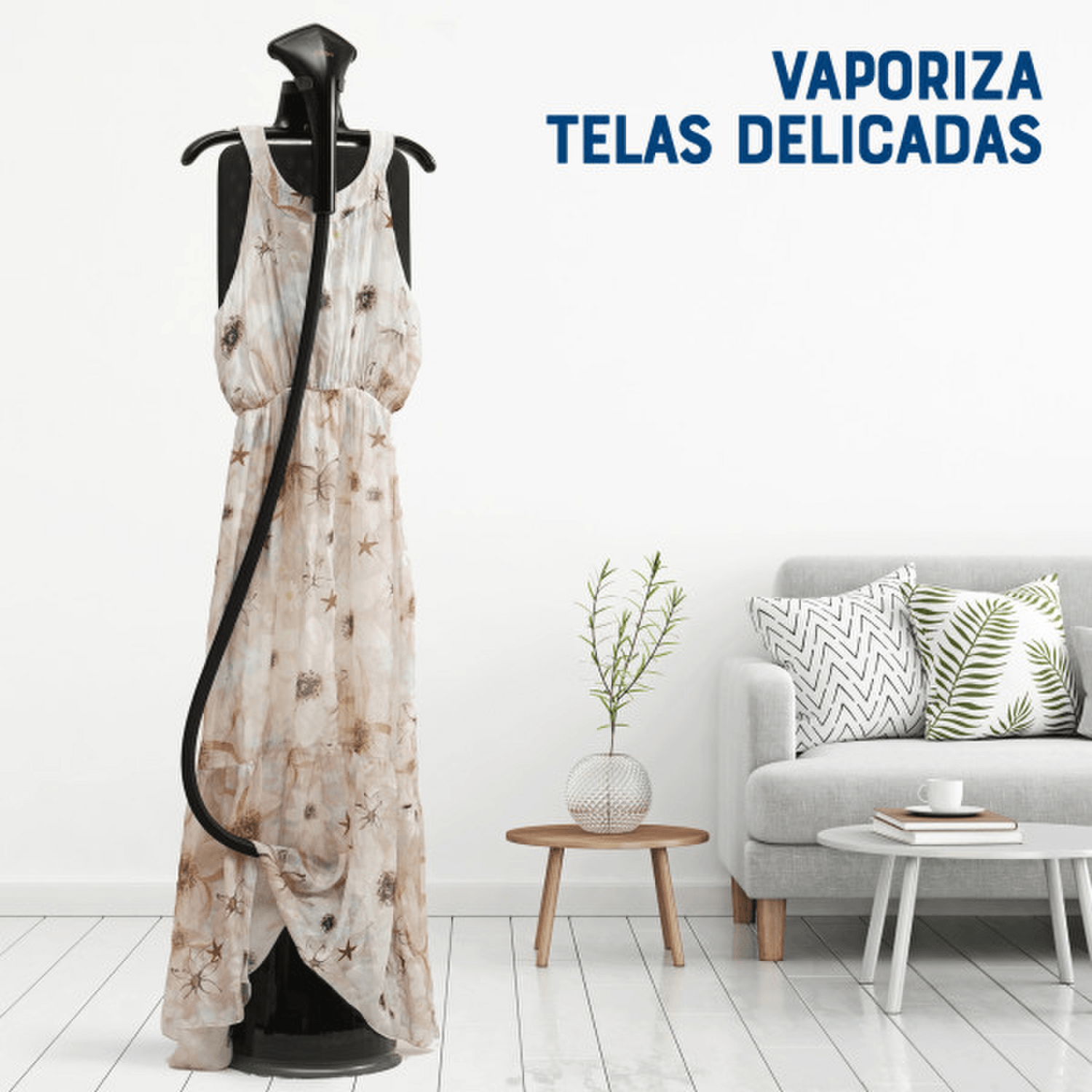 Vaporizador Centro De Planchado Oster 1800W Con Gancho 1,8L en uso con vestido delicado en ambiente moderno.