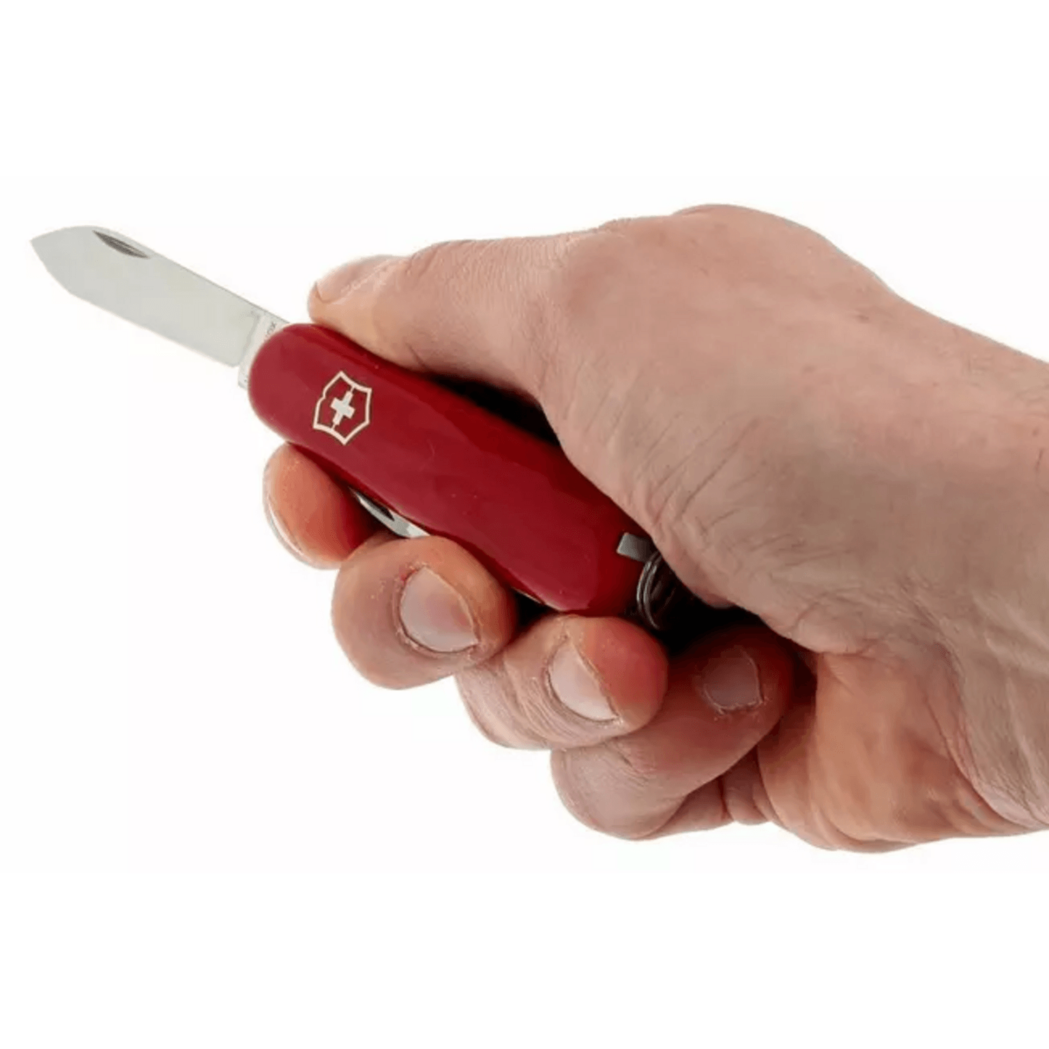 Navaja suiza compacta Victorinox Recruit en la mano, mostrando su diseño funcional y color rojo.