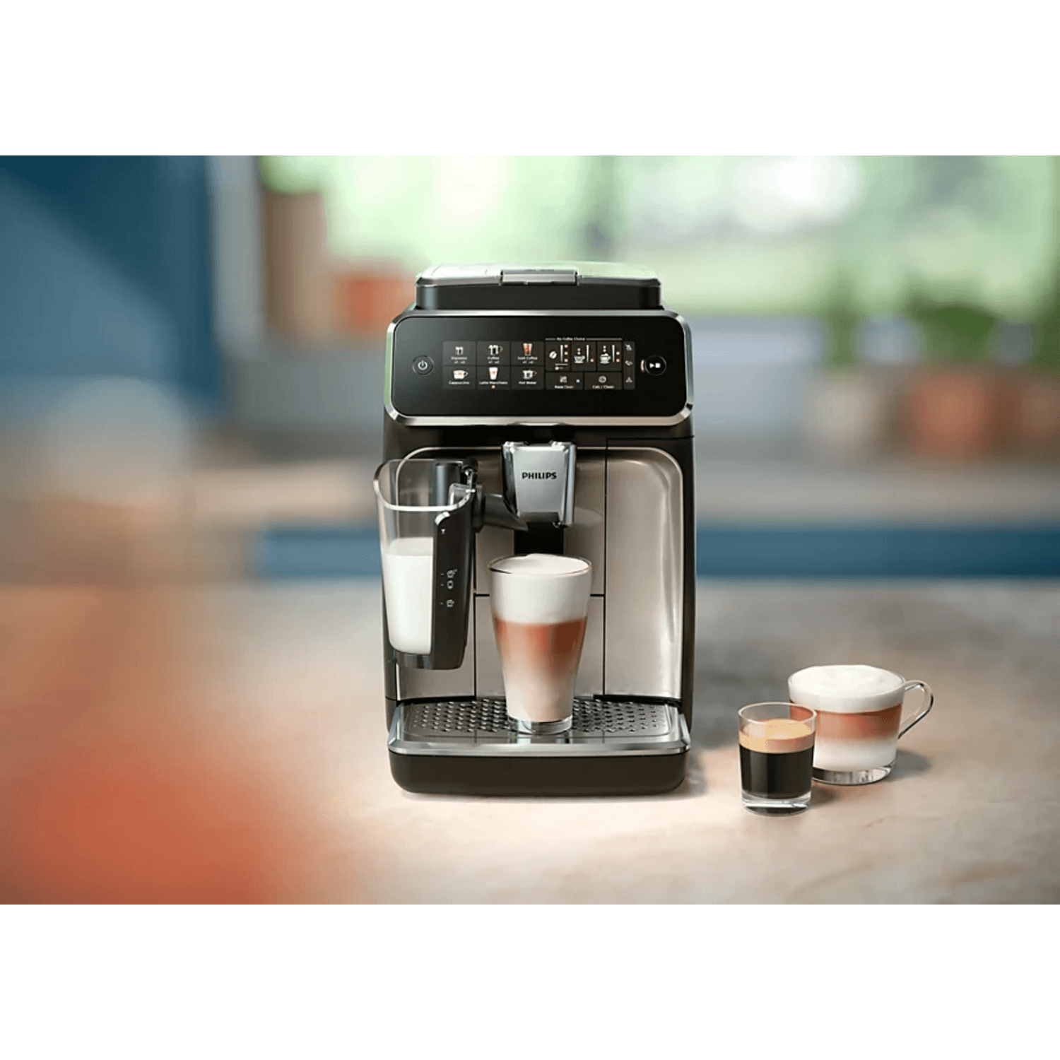 Cafetera superautomática Philips EP3341 preparando diversas bebidas de café en la cocina.